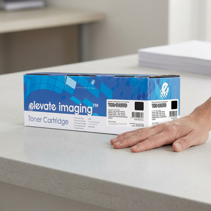 A comparison of an Elevate Imaging toner cartridge's length against a typical adult hand.