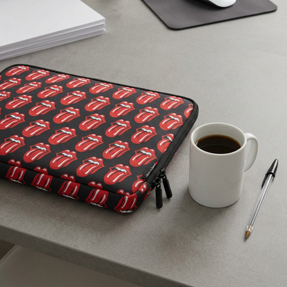 Bugatti laptop sleeve on desk beside coffee mug and pen for size reference.