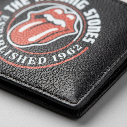 Macro photograph focusing on the fine pebble grain texture of the leather and the detailed Rolling Stones logo print.