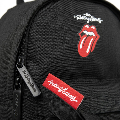 A close-up photograph of the textured nylon fabric, "Rolling Stones" logo print, and zipper pulls.