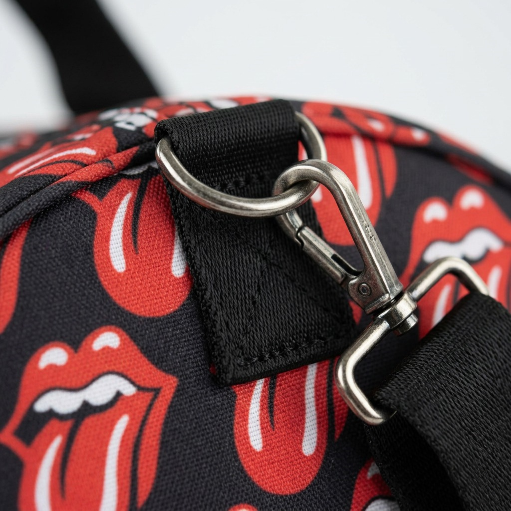 Macro detail of the Rolling Stones duffle bag hinge and logo pattern.