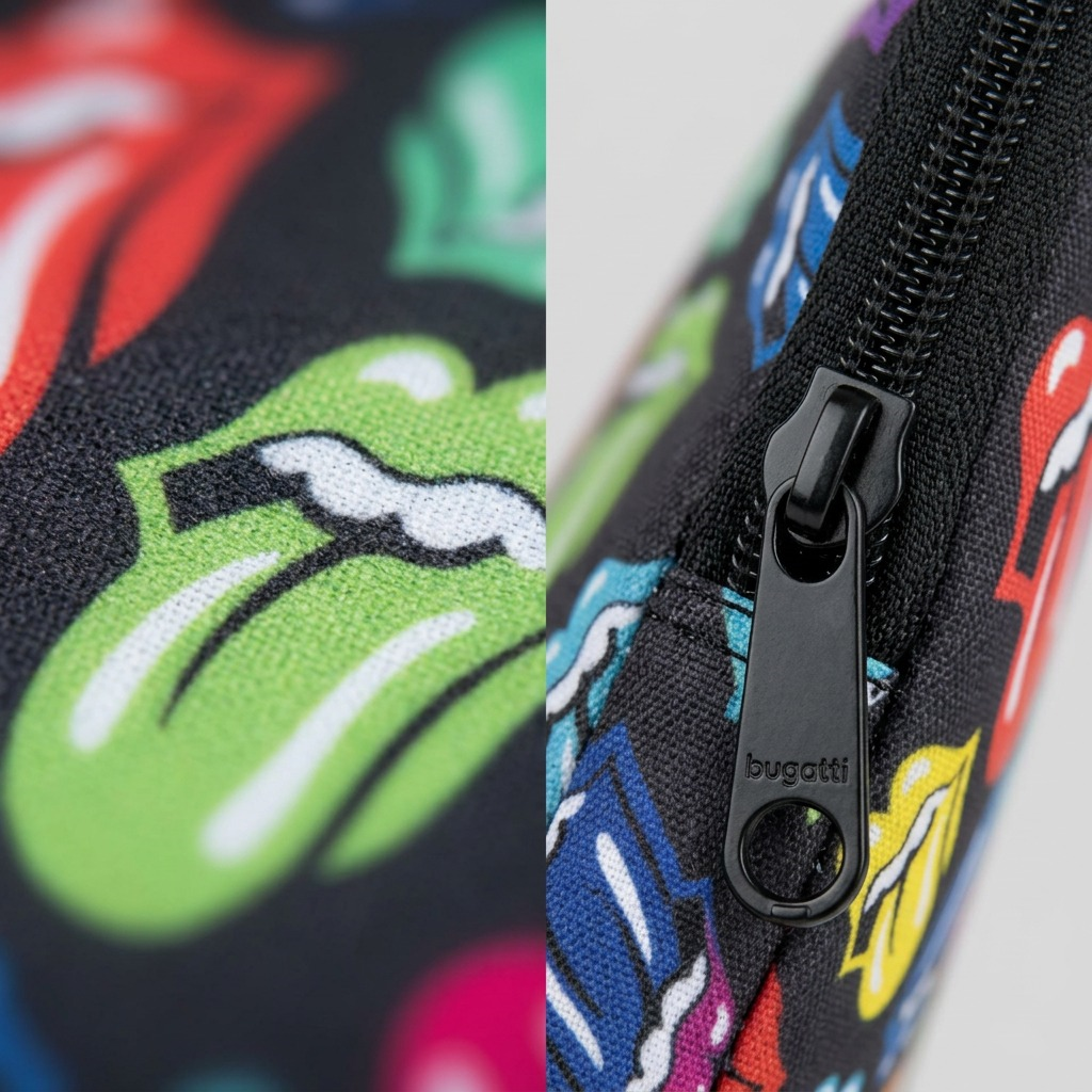 Extreme close-up macro view of the padded laptop sleeve material, showing a detailed fabric texture and a vibrant Rolling Stones 'Hot Lips' logo pattern. A black zipper track and metal pull tab are in sharp focus.
