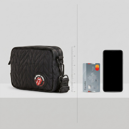 A visual comparison image shows a Rolling Stones cross body bag next to a credit card-sized object and a bottle for true scale reference.
