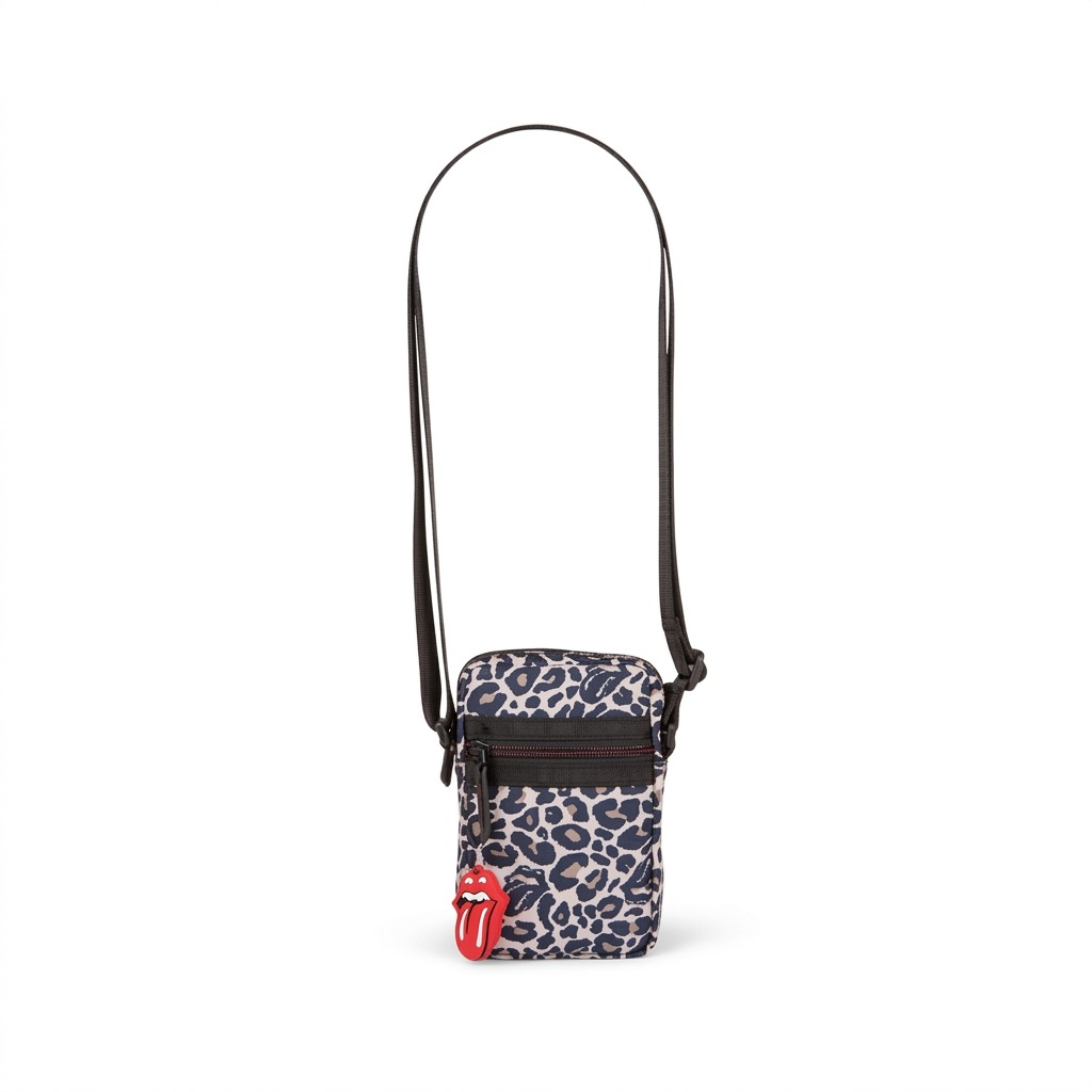 A high-resolution hero shot of the leopard print mobile crossbody case with the Rolling Stones logo charm.