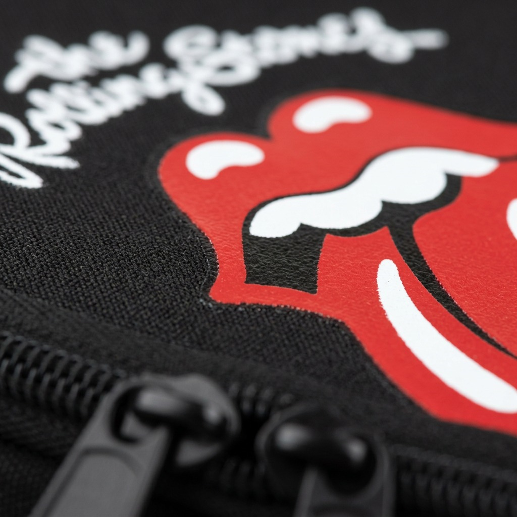 Macro photograph focusing on the textured fabric weave, screen-printed logo, and red Bugatti label.