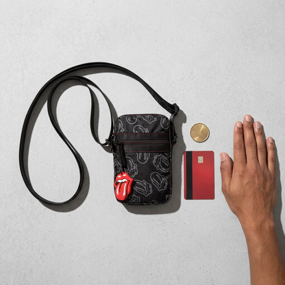 Mobile case shown with a 16-inch MacBook Pro and a hand with a credit card for scale.