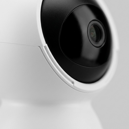 "Macro view of mechanical tracks and lens on LEDVANCE SMART+ Pan & Tilt camera sphere."