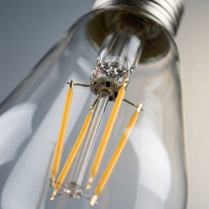 A macro photo focuses on the LED filaments within the ST19 bulb, showing precise internal assembly.