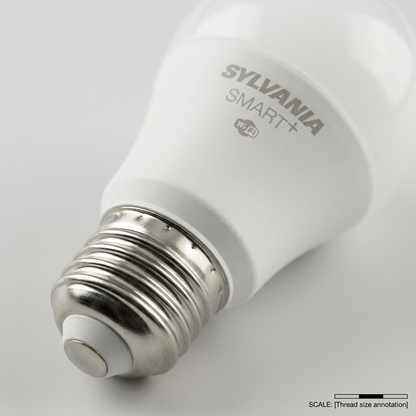 A detailed macro photograph showing the precise SYLVANIA SMART+ laser marking and the fine threads of the metal Edison screw base on the smart bulb.