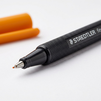 Macro photo features STAEDTLER fineliner metal tip, fine line, and body details.