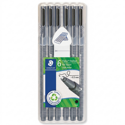 Pure high-resolution hero shot. Single pack of 6 black Staedtler Triplus fineliners in a stand-up clear plastic box, showing the black ink and 0.3mm tip size on the central paper insert. Set against a pure white background with a clean shadow.