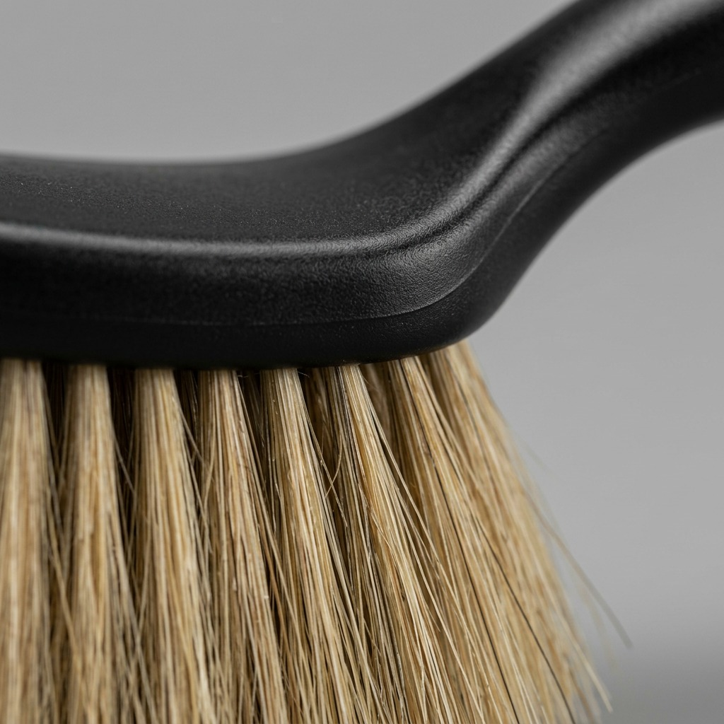 Macro close-up of natural hair bristles meeting a black handle on a STAEDTLER Dusting brush mini