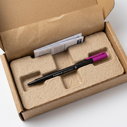 STAEDTLER purple fineliner shown in protective corrugated and molded pulp shipping packaging for unboxing.