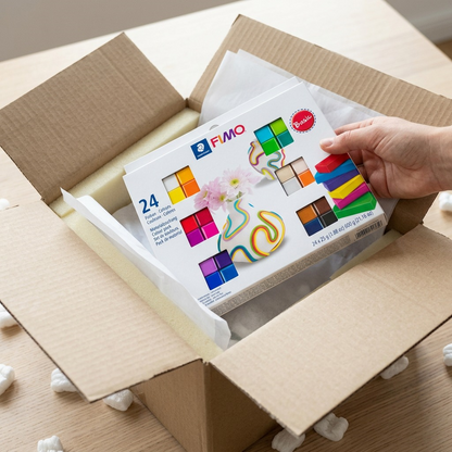 A photo of the STAEDTLER Fimo Set in open shipping box with foam and tissue padding for protected delivery.