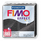 Pure studio photograph of one single 57g (2 oz) block of black Staedtler Fimo Effect Stardust polymer clay in its clear plastic packaging, showing the glitter finish, Staedtler and Fimo Effect branding, and weight, isolated on a perfect white background, centered with clean high-resolution details.