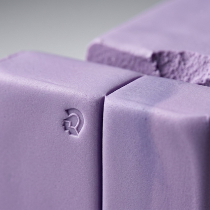A macro close-up image showing the smooth, lavender-colored STAEDTLER Fimo Soft modeling clay segments.