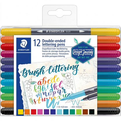 Hero shot of Staedtler 3004-TB12-02 brush lettering pens in a transparent plastic pack, white background
