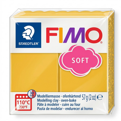 High-resolution hero shot of STAEDTLER Fimo Soft Mango Caramel modeling clay block on white.