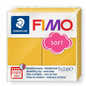 High-resolution hero shot of STAEDTLER Fimo Soft Mango Caramel modeling clay block on white.