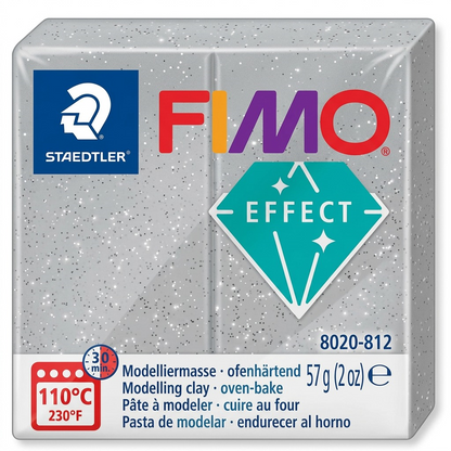 A high-resolution, centered view of a 57g (2 oz) block of grey glitter FIMO Effect oven-bake modelling clay (STAEDTLER, item 8020-812) on a white background, featuring realistic texture and markings.