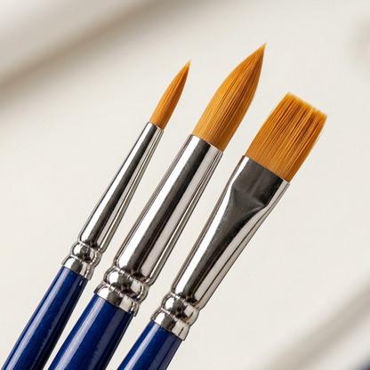 Macro photo detail of the STAEDTLER 989-SBK3-302 brush heads, focusing on the distinct synthetic bristle shapes and metal ferrules.