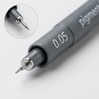 Macro photo detailing the STAEDTLER pigment liner tip, '0.05' marking, and texture.