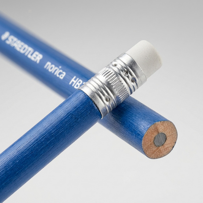 Macro photo detail highlighting the eraser, ferrule, and HB2 print texture on blue STAEDTLER pencils.