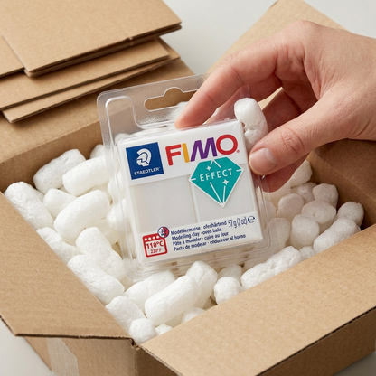 Unboxing a secure shipment of durable Fimo Effect modelling clay, with protective cushioning.