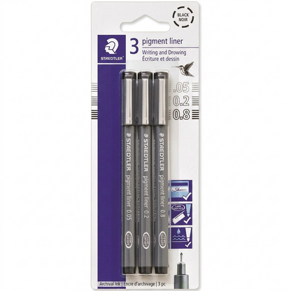 A pack of three black STAEDTLER Pigment Liner pens with different line widths (0.05mm, 0.2mm, 0.8mm) in their original blister packaging, centered against a pure white background with realistic lighting and a soft shadow.