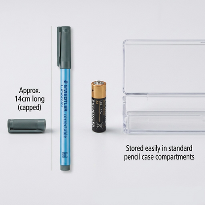 A photorealistic comparison shot showing a STAEDTLER Lumocolor 305-M-9-03 marker next to a standard AA battery.