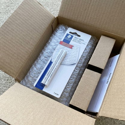 A photographic view of a shipping box with the Staedtler Mars refill erasers safely wrapped in bubble wrap.