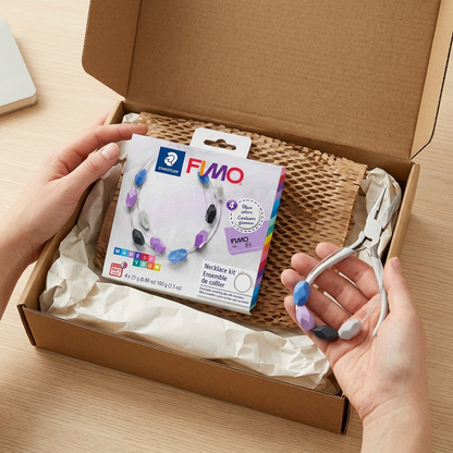 The Fimo necklace kit arriving safely in durable protective mailing materials for transit confidence.
