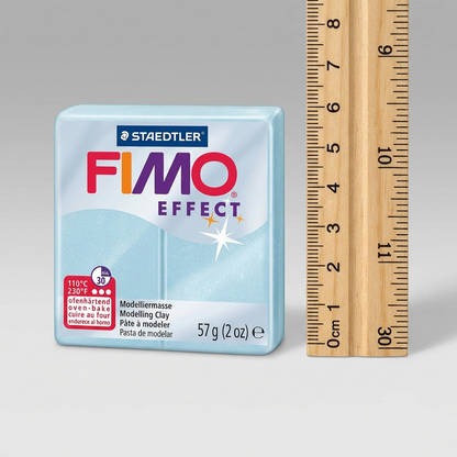 A 57g Fimo Effect block beside a standard 30cm ruler, illustrating its compact size for crafting.