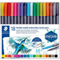 A pure high-resolution hero shot of the STAEDTLER Double-ended watercolour brush pens set in its original 18-piece cardboard box. The box features the STAEDTLER logo, product descriptions in English and German, a vibrant watercolor illustration of a hummingbird, and a window to view the rainbow assortment of dual-tip pens. The set is neatly packaged with a clear plastic insert, presented against a clean white background.