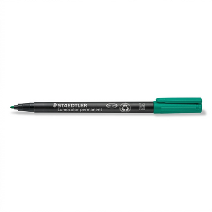 A detailed high-resolution product shot of a green STAEDTLER Lumocolor permanent marker.