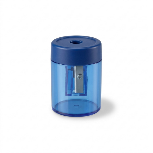 A high-resolution, centered view of the STAEDTLER Single-hole metal screw-tip manual pencil sharpener, model 511-63BKA6, with its translucent blue canister and solid blue lid on a pure white background.