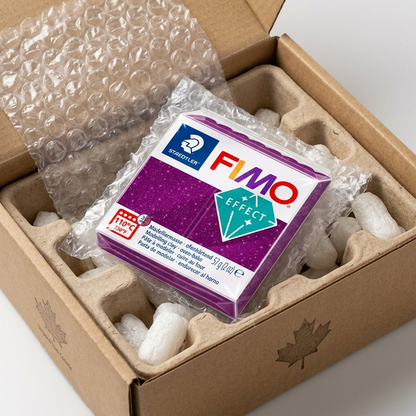Confidence-inspiring photo showing the Fimo Effect clay protected by neutral bubble packing.