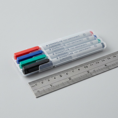 STAEDTLER 311-WP4 non-permanent markers in a clear case, shown next to a standard metal ruler.