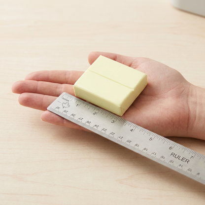 PDA scale comparison of a STAEDTLER FIMO Soft Vanilla block resting in a hand beside a standard wooden ruler.