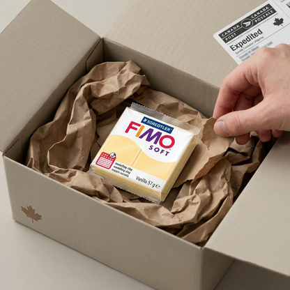 A vanilla Fimo Soft clay puck in its correct packaging lies protected in a shipping box.
