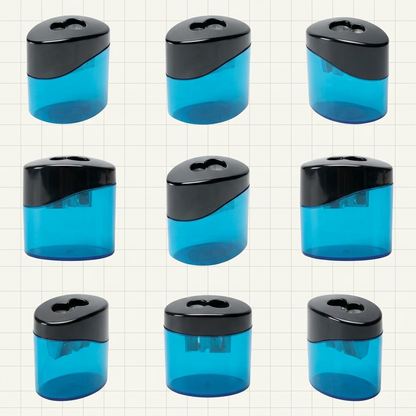 A grid of four images showcasing the blue STAEDTLER two-hole oval pencil sharpener from front, side, angled, and top-down views.