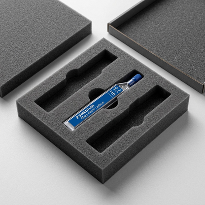 A premium unboxing view, with a single 0.7mm HB lead container nested within protective foam.