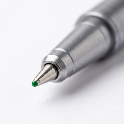 Macro shot of the green STAEDTLER triplus finseliner point showing the precise 0.3mm metal writing tip.