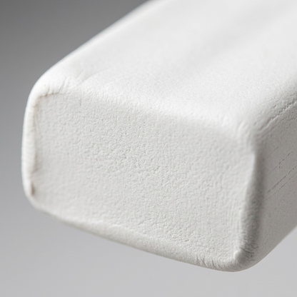 A macro photo focuses sharply on the dense, matte texture of the Staedtler FIMO soft white clay brick.