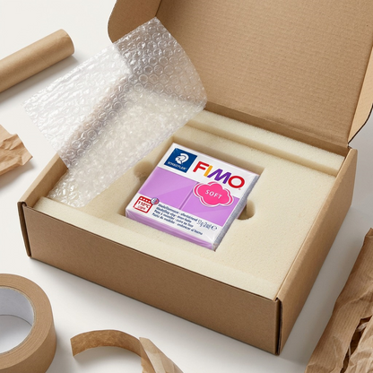 An unboxing scene shows the FIMO Soft Lavender clay inside a cardboard box with foam.