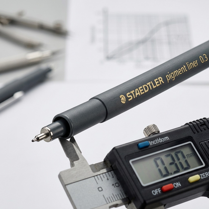 Macro close-up shows the fine 0.3mm fiber tip and crisp "STAEDTLER" barrel branding.