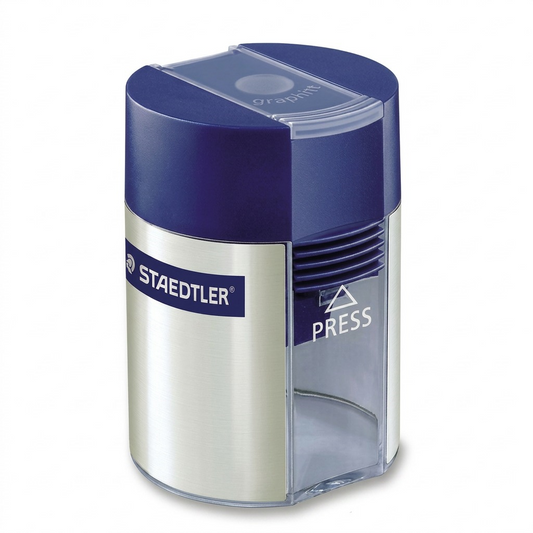 A high-resolution product shot of the STAEDTLER 511-001-A602 metal sharpener and waste container.