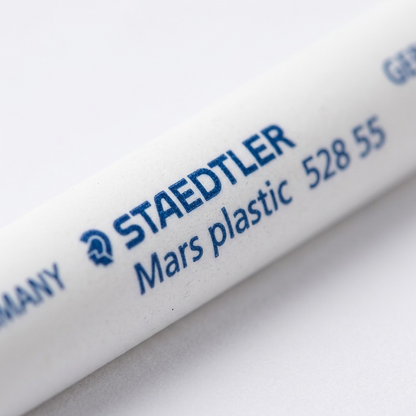 Macro detail view of critical STAEDTLER Mars plastic markings on a white refill core.