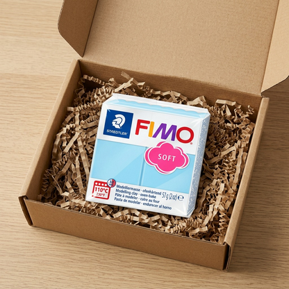 Product delivery showing a pristine block of Fimo Soft Aqua in a clean shipping box.