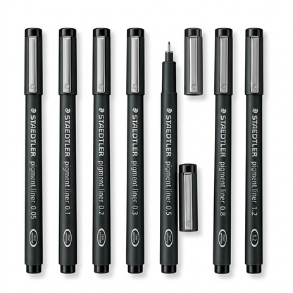 A high-resolution, centered flat lay photograph of eight Staedtler Pigment Liner technical pens, in black barrels with metallic caps, showing the range of sizes from 0.05mm to 1.2mm. All standard brand markings are visible.